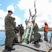 Sailors load mines on USS Annapolis