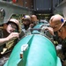 Sailors load mines on USS Annapolis