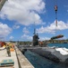 Sailors load mine on USS Annapolis