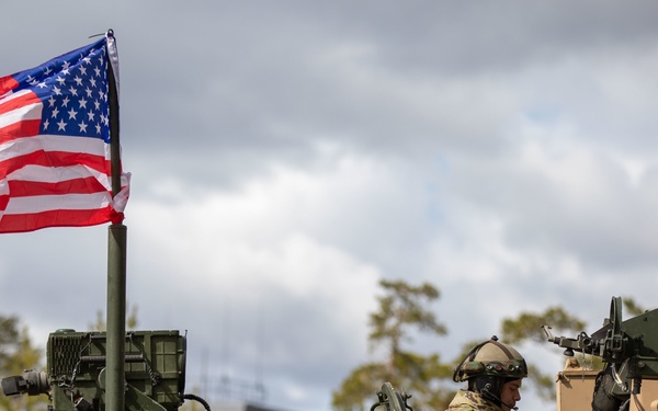 U.S. Army Soldier communicates on radio during tactical road march at Exercise Arrow 22