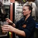 Abraham Lincoln Sailor prepares coffee