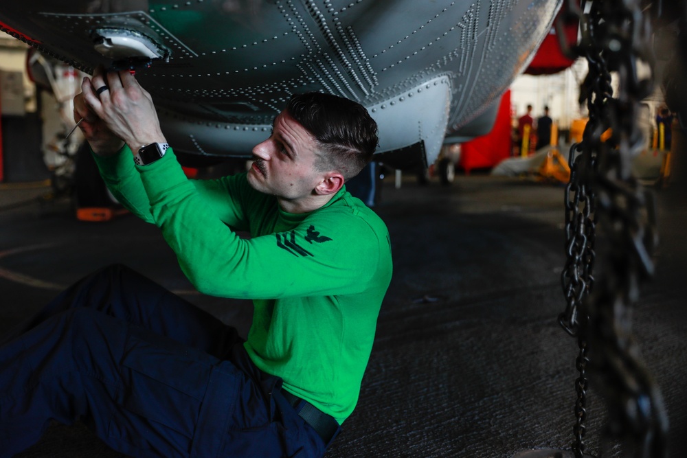 Abraham Lincoln Sailor conducts maintenance