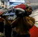 Abraham Lincoln Sailors move ordnance equipment