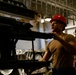 Abraham Lincoln Sailors move ordnance equipment