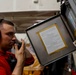 Abraham Lincoln Sailors move ordnance equipment