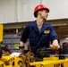 Abraham Lincoln Sailors move ordnance equipment