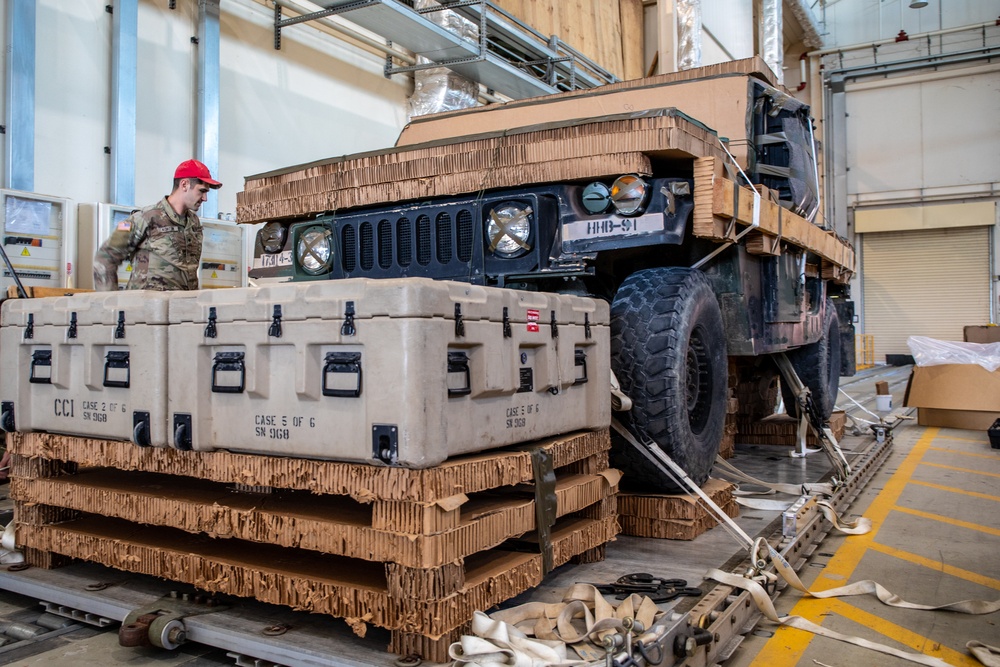 Paratroopers prepare equipment for airborne drop into Exercise Swift Response