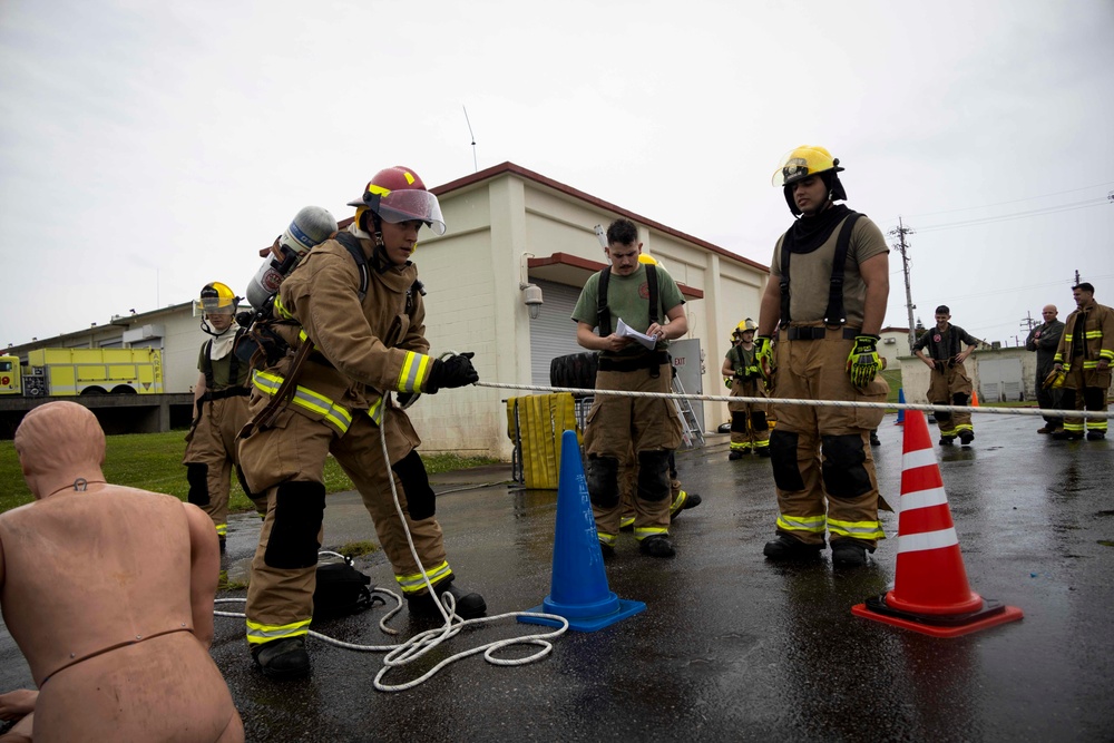 Military firefighters conduct the Physical Abilities Test