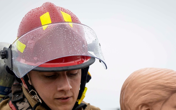 Military firefighters conduct the Physical Abilities Test