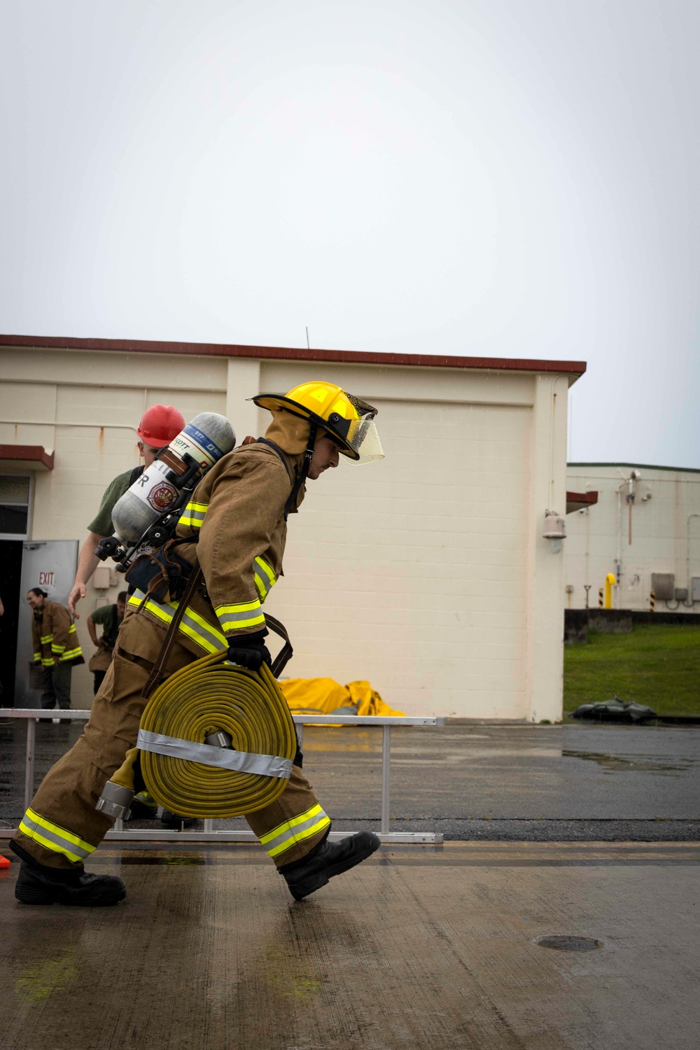 Military firefighters conduct the Physical Abilities Test