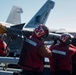 Abraham Lincoln Sailors load ordnance