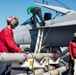 Abraham Lincoln Sailors load ordnance