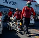 Abraham Lincoln Sailors load ordnance