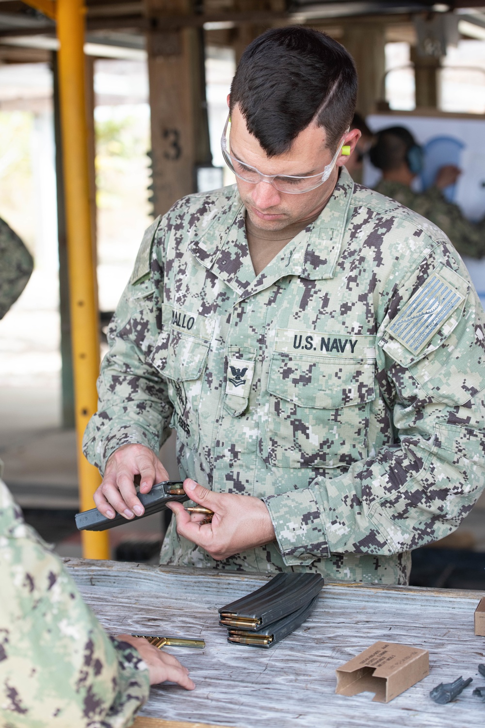 NMCB-14 qualifies members in the M-18 pistol and M-4 rifle small arms platforms.