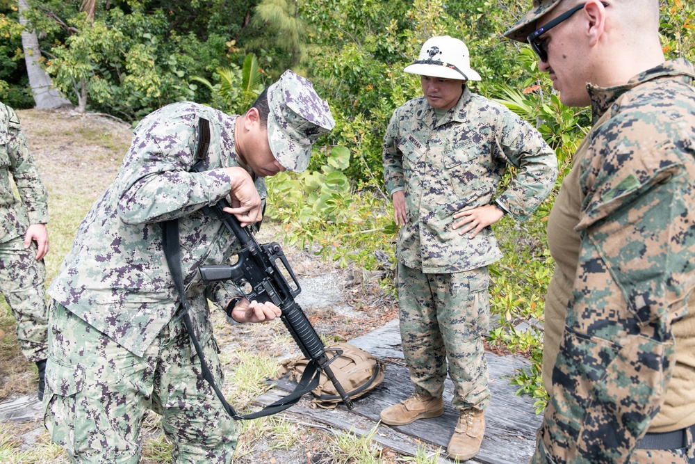 NMCB-14 qualifies members in the M-18 pistol and M-4 rifle small arms platforms.