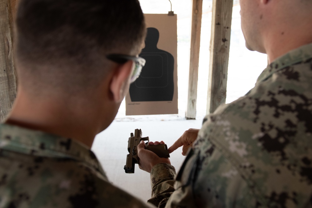 NMCB-14 qualifies members in the M-18 pistol and M-4 rifle small arms platforms.