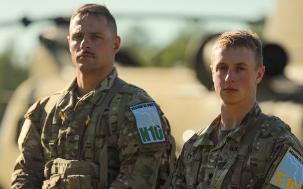 U.S. Army National Guard Sgt. Matthew Fiore, left, and Spc. Keenan Baxter, right,