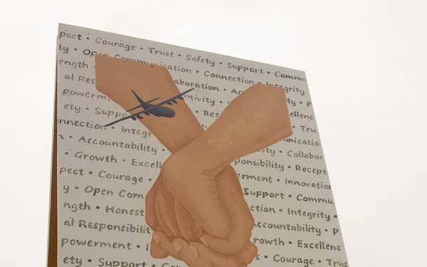 Art of gold: 934 AW SARC creates mural for Sexual Assault Awareness Month