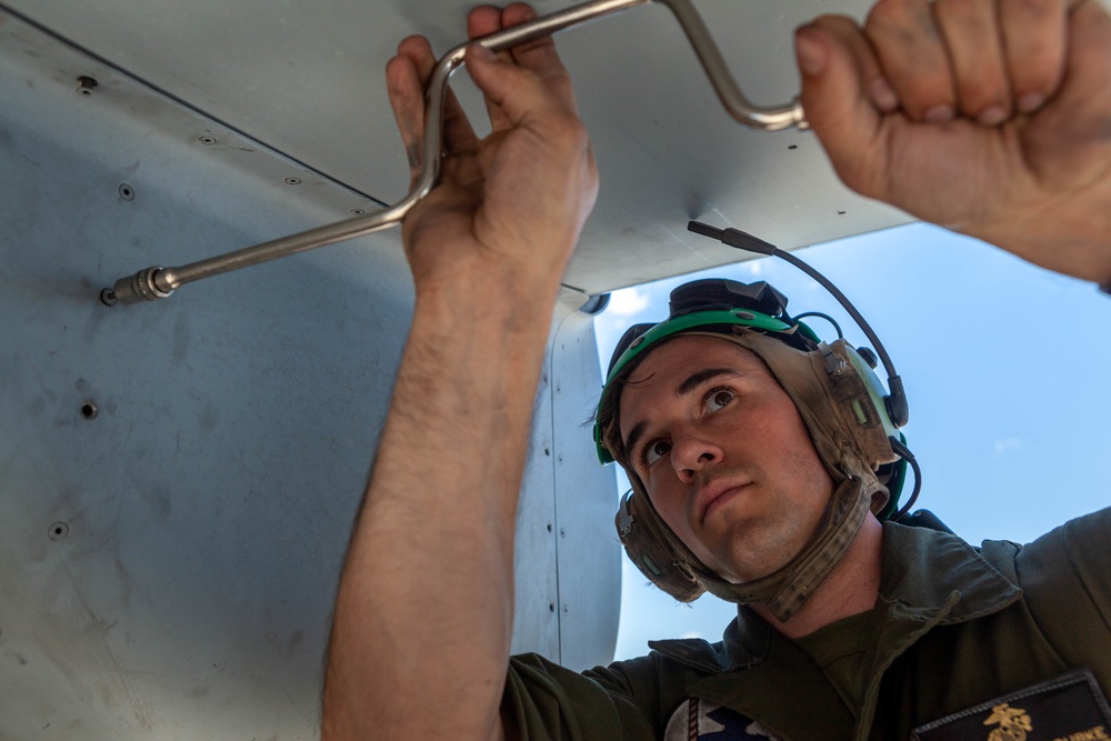 MV-22B Osprey Mechanic Searches for Fluid Leak