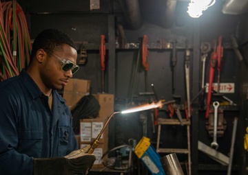 Sailor ignites torch