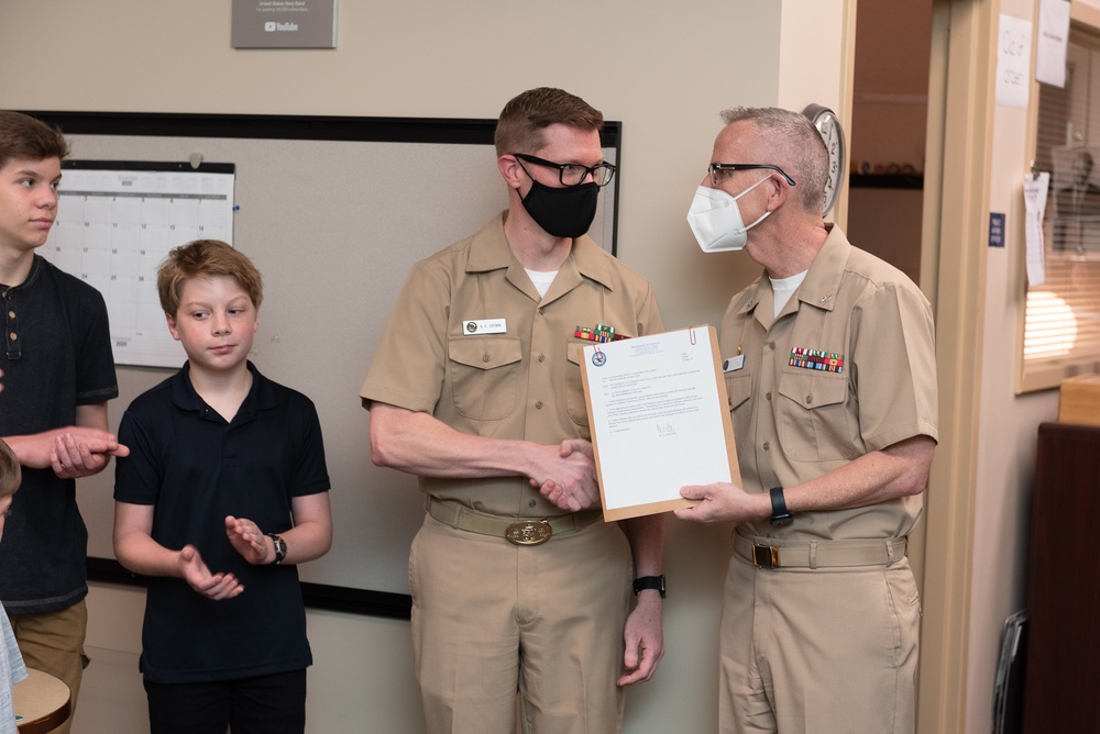 Master Chief Musician Adam Grimm, Navy Band Public Affairs Officer, is pinned to E9