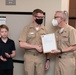 Master Chief Musician Adam Grimm, Navy Band Public Affairs Officer, is pinned to E9