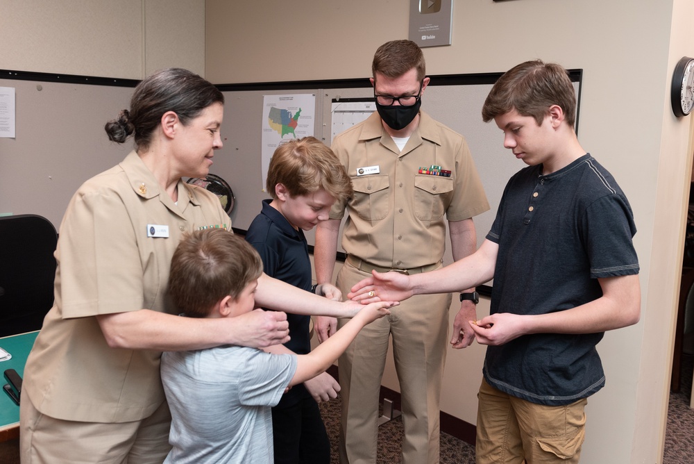 Master Chief Musician Adam Grimm, Navy Band Public Affairs Officer, is pinned to E9