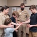 Master Chief Musician Adam Grimm, Navy Band Public Affairs Officer, is pinned to E9