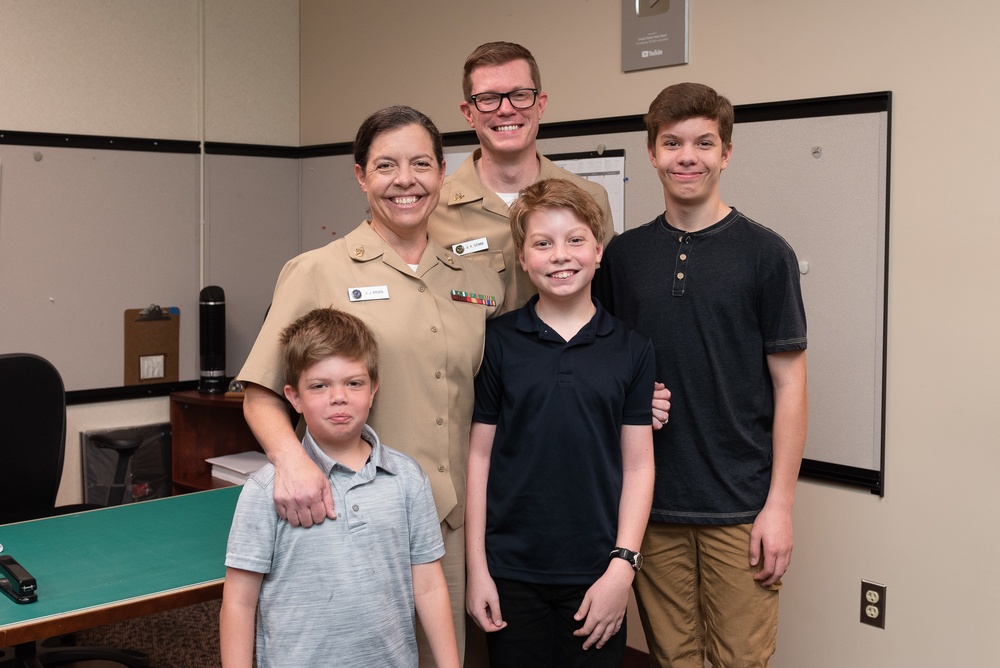 Master Chief Musician Adam Grimm, Navy Band Public Affairs Officer, is pinned to E9