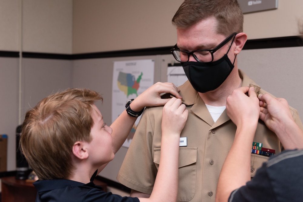 Master Chief Musician Adam Grimm, Navy Band Public Affairs Officer, is pinned to E9