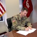 Col. Travis Rayfield, commander, Kansas City District signs agreement