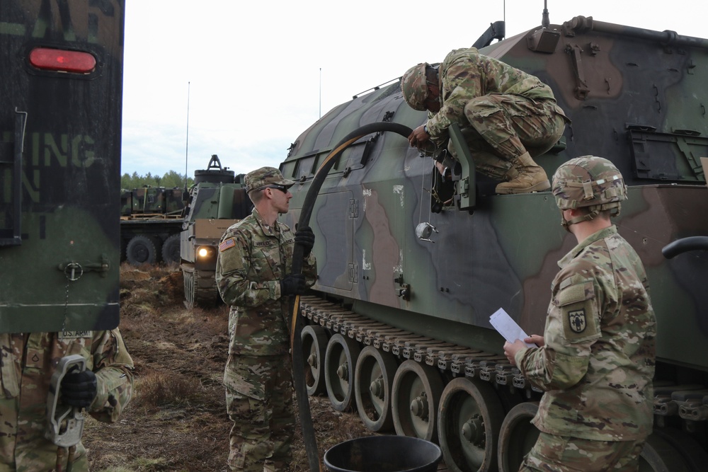 1-109th Field Artillery Soldiers fuel vehicles for exercise in Lithuania