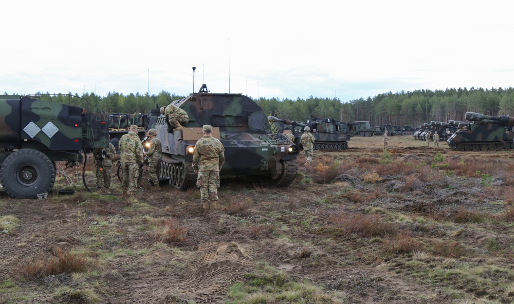 1-109th Field Artillery Soldiers fuel vehicles for exercise in Lithuania