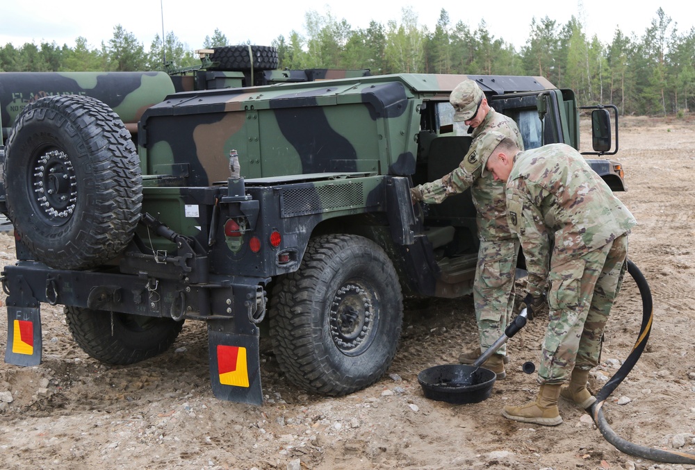 1-109th Field Artillery Soldiers fuel vehicles for exercise in Lithuania