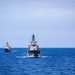 U.S. and Greek (Hellenic) naval ships sail in formation