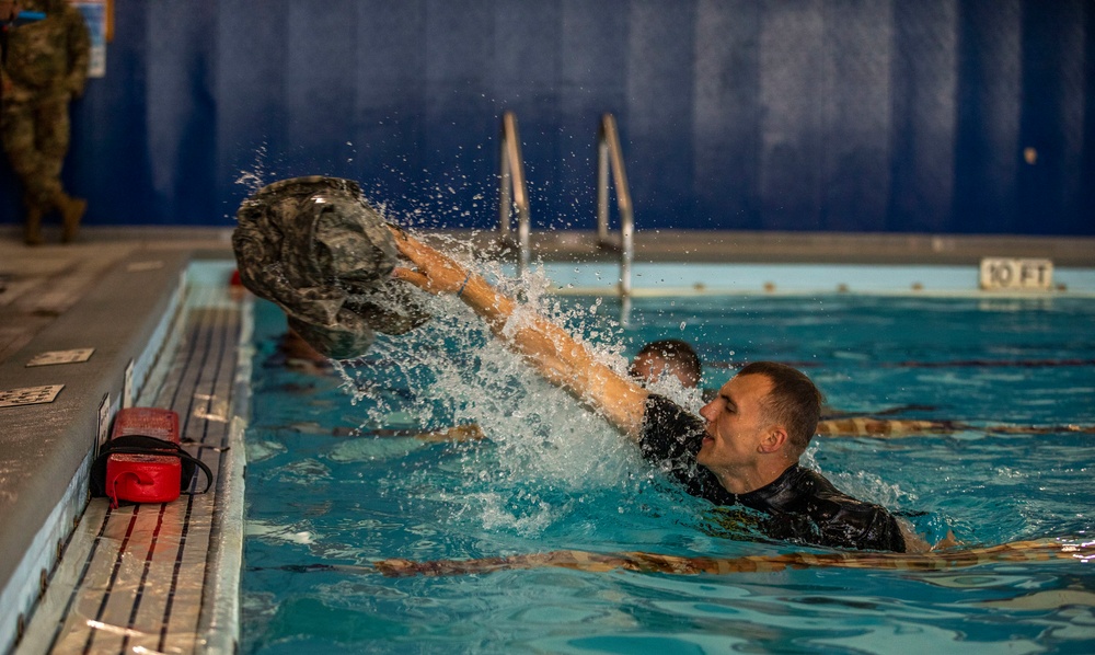 Staff Sgt. Amick Philip tosses his uniform top