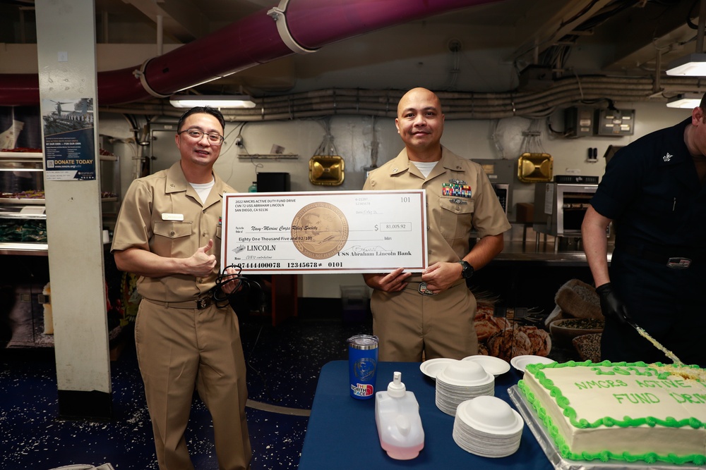 Abraham Lincoln Sailors present a check