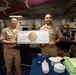 Abraham Lincoln Sailors present a check