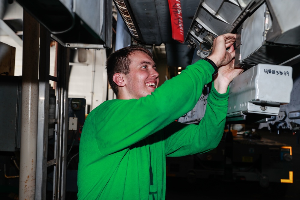 Abraham Lincoln Sailors conduct aircraft maintenance