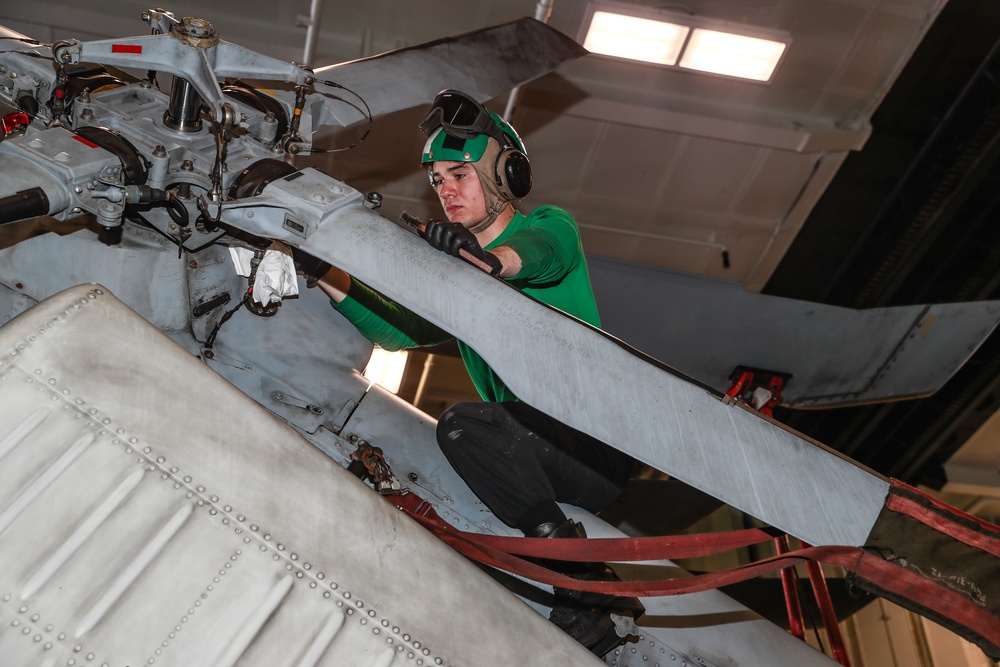Abraham Lincoln Sailors conduct aircraft maintenance
