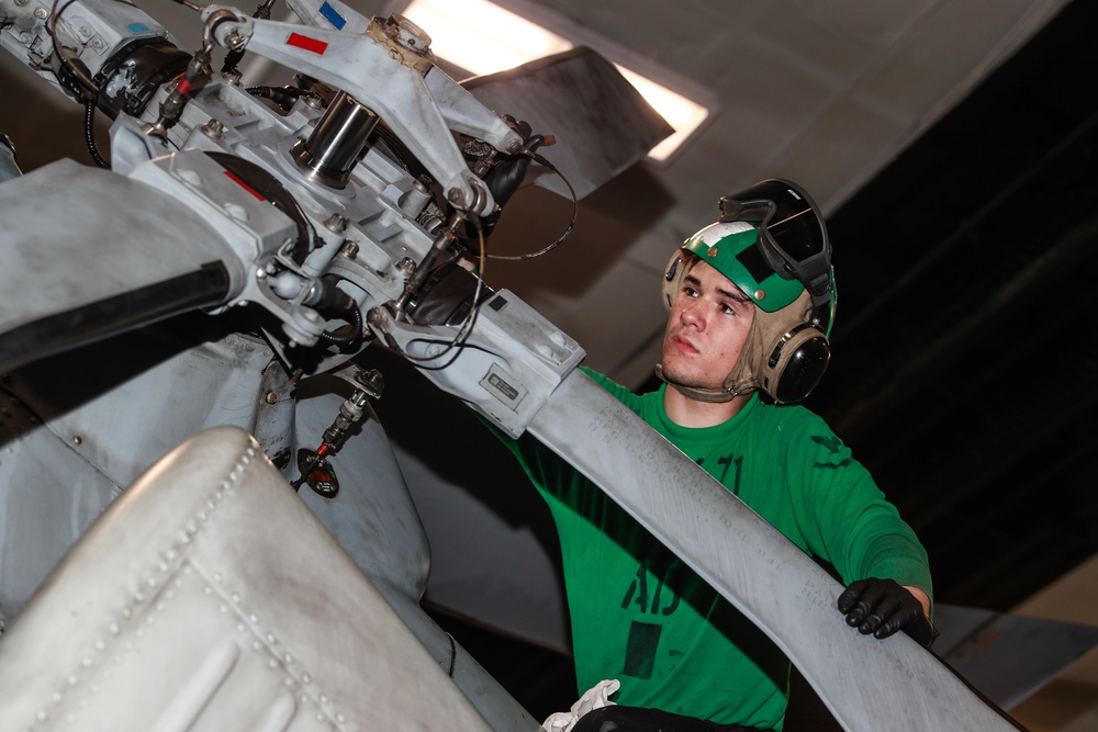 Abraham Lincoln Sailors conduct aircraft maintenance