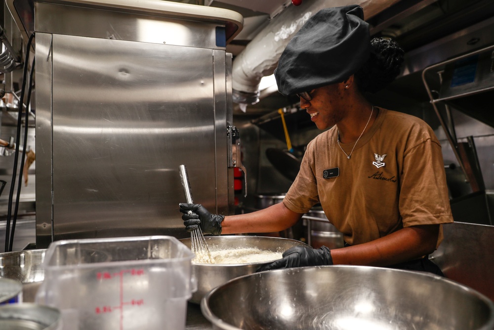 Abraham Lincoln Sailors prepares food