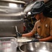 Abraham Lincoln Sailors prepares food