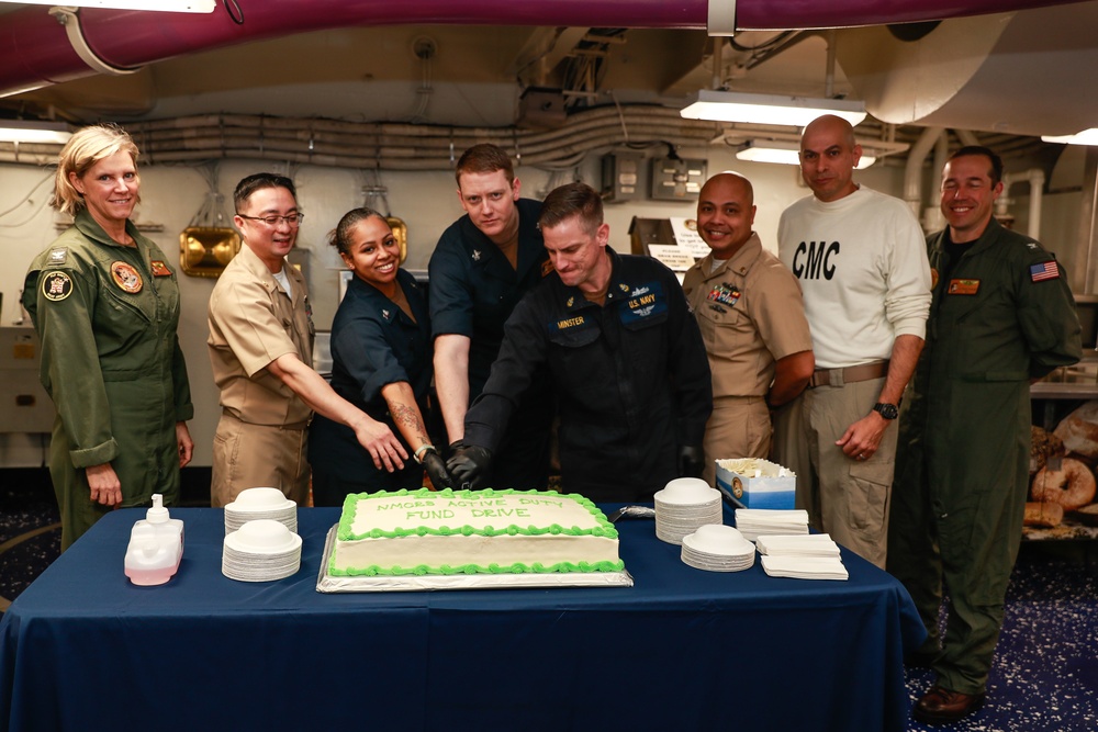 Abraham Lincoln Sailors cut cake