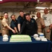 Abraham Lincoln Sailors cut cake