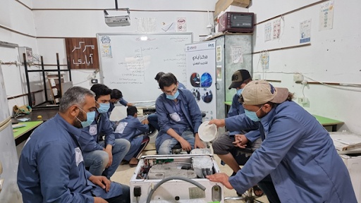 HVAC &amp; home appliance trainees dismantle, repair, and reassemble a washing machine.