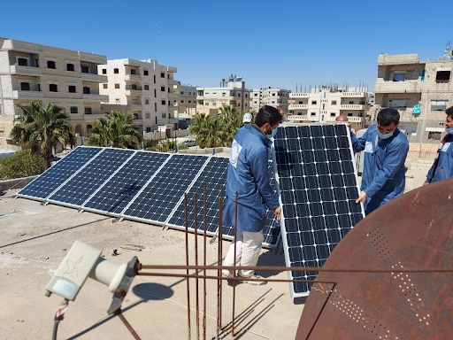 Solar panel repair trainees participate in their vocational training course in Tabqa.