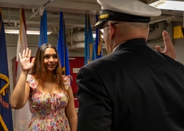 Rear Adm. Dennis Velez Issues Oath of Enlistiment to Daughter