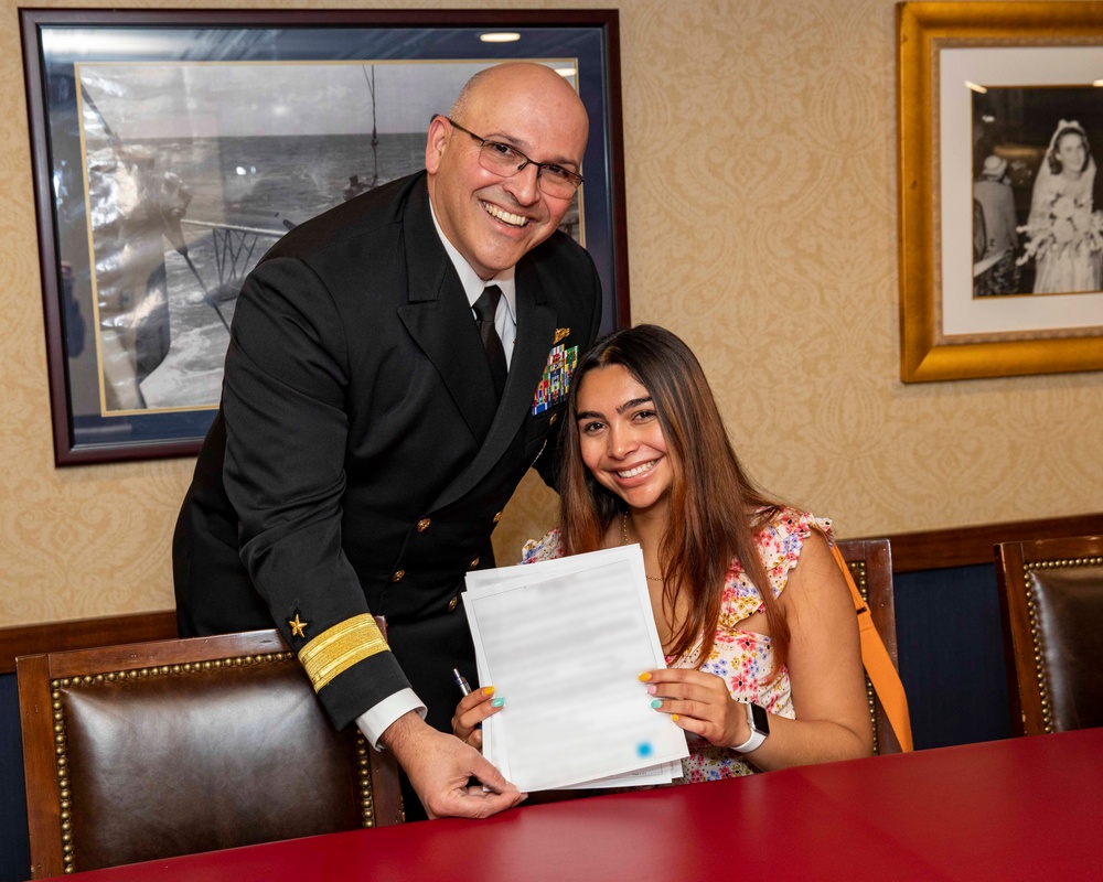 Rear Adm. Dennis Velez Issues Oath of Enlistiment to Daughter
