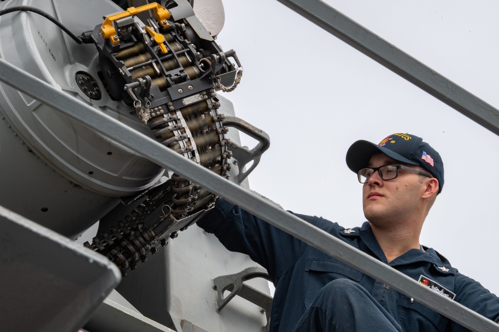 USS Milius loads weapons systems